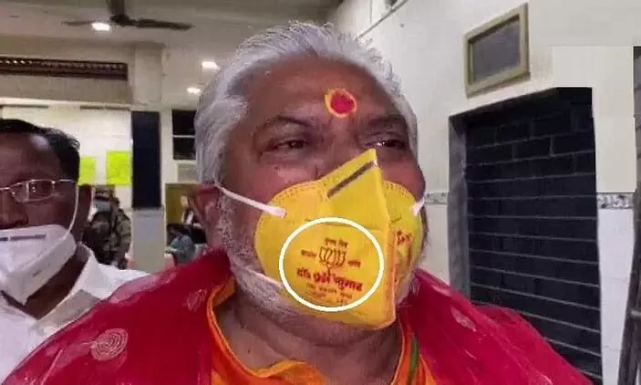 Bihar Minister Prem Kumar in trouble for wearing lotus mask