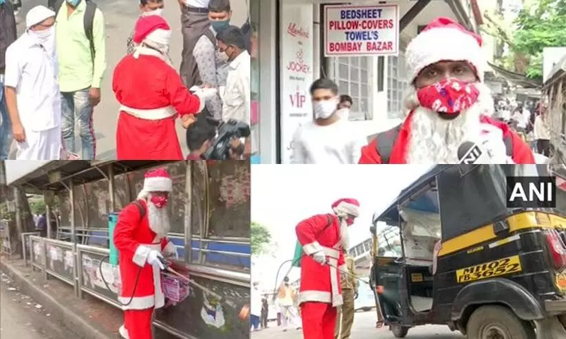 മുംബൈയിൽ അണുനാശിനി തളിച്ച്​ സാന്ത​ക്ലോസ്​​; സമ്മാനമായി മാസ്കും