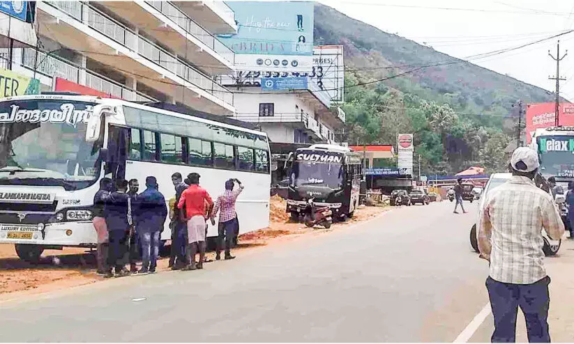 tourist bus with migrant laborers