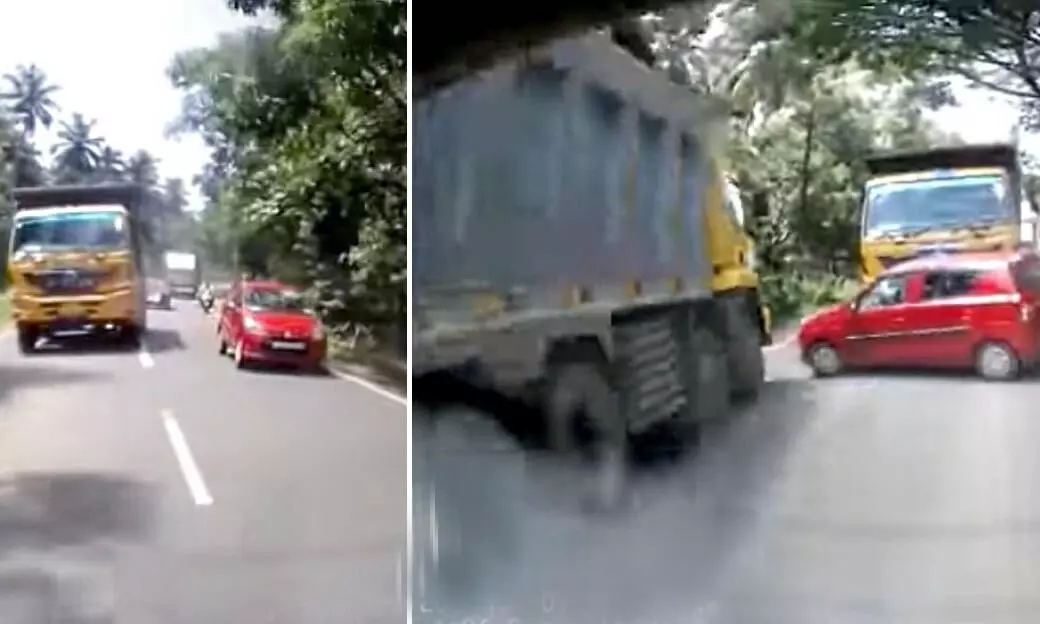 Car nearly gets sandwiched between two huge trucks after