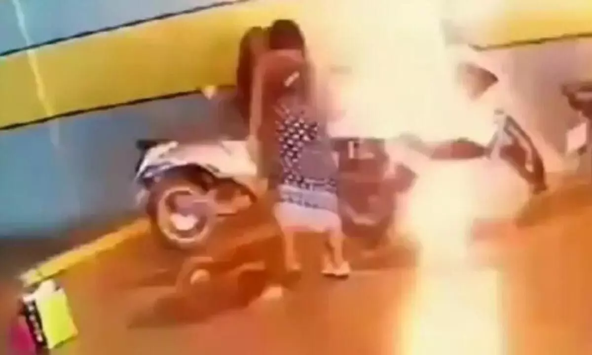 Woman sets fire