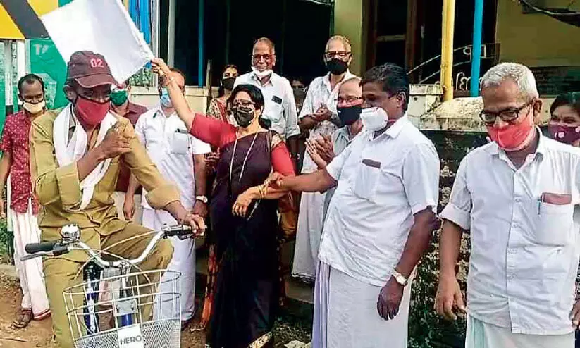 Postman Krishnamurthy on a bicycle To Ernakulam