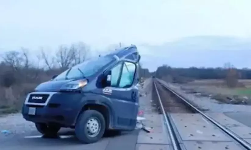 Train slices Amazon delivery truck in half