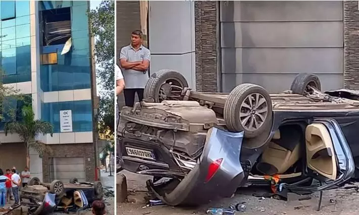 Car falls from parking lot on second floor driver