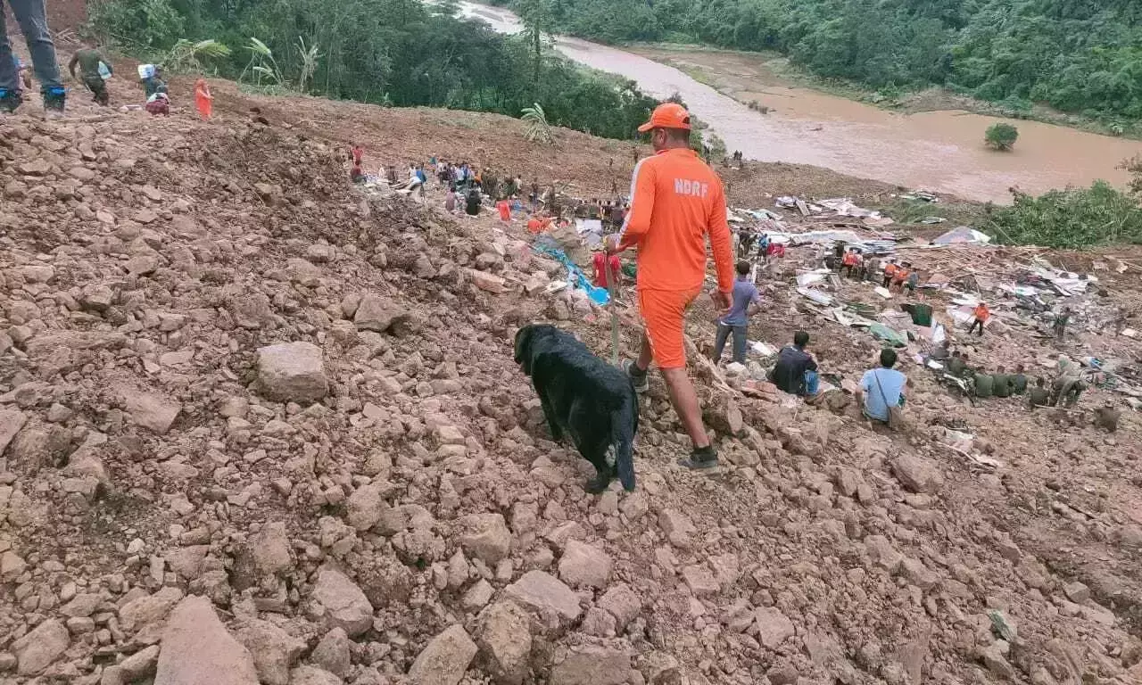 NDRF personnel and others trying to rescue those buried under the debris