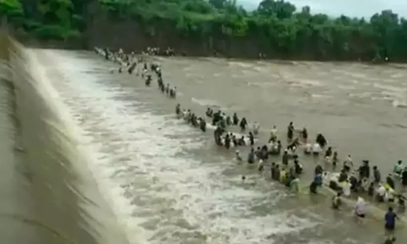 People Fish Dangerously Close To Water Released From Maharashtra Dam