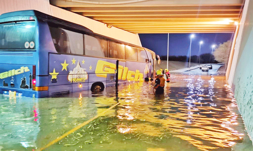 Rescued bus passengers stuck in flood