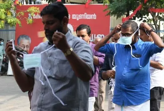 Kerala Govt makes masks sanitizers mandatory