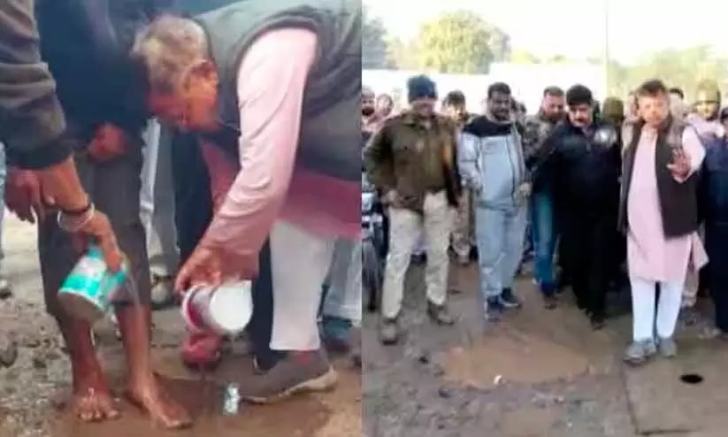 Minister washes feet of person to apologise for bad condition of road