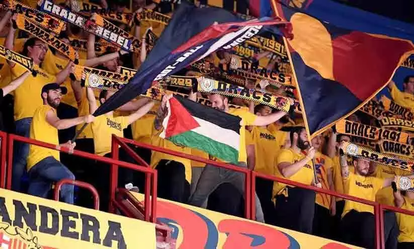 Barcelonas supporters wave the Palestinian flag