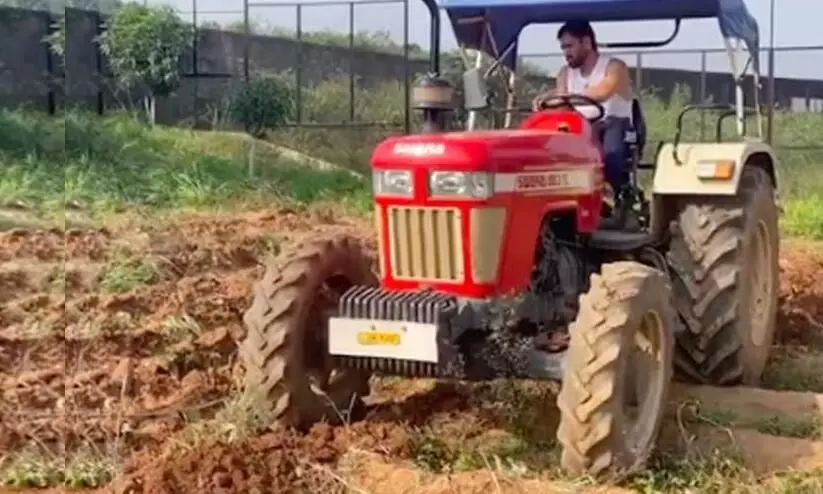 MS Dhoni flaunts tractor driving video farming Ranchi farmhouse social media