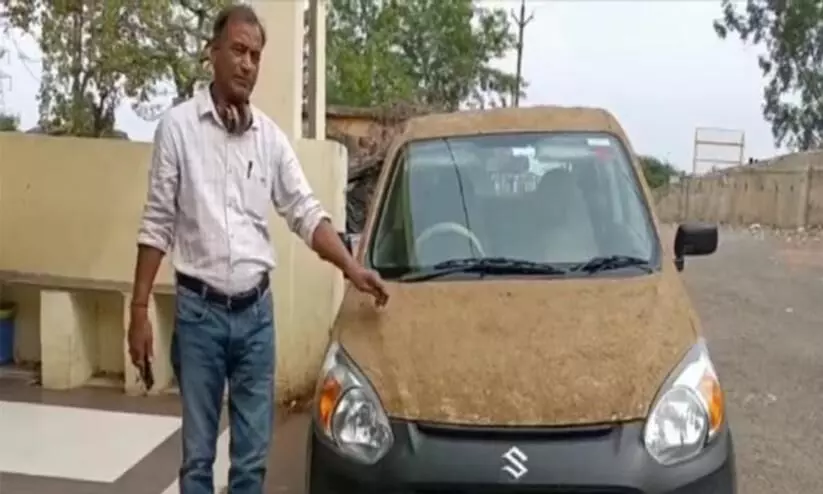 Madhya Pradesh Doctor plasters his Maruti Alto 800 with cow dung
