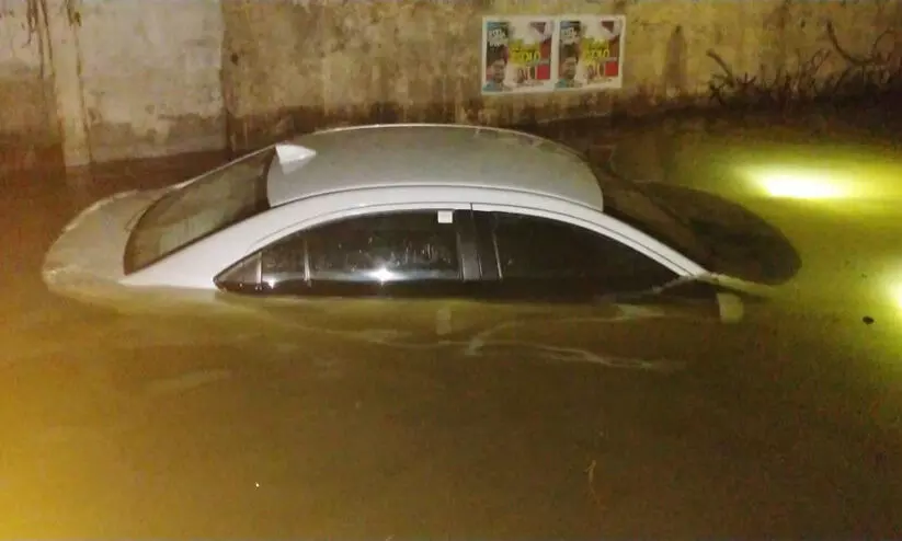 The car sank in the watershed on the railway under bridge