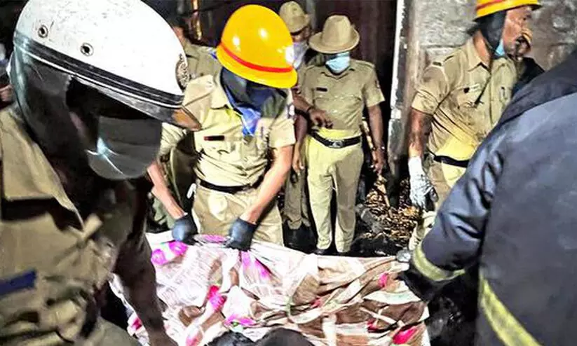 Rescue work underway at the site of the fire accident at Attibele near Bengaluru on October 7, 2023