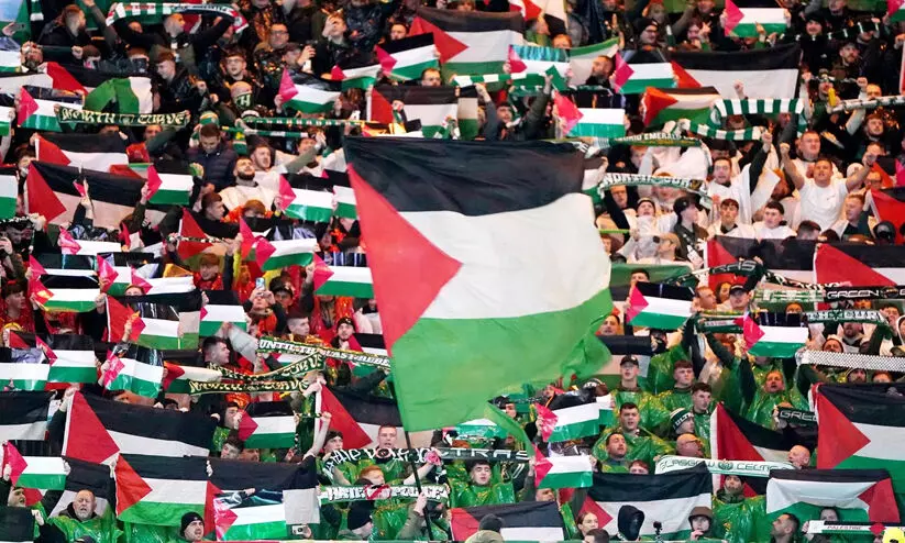 Celtic FC fans with Palestine flag