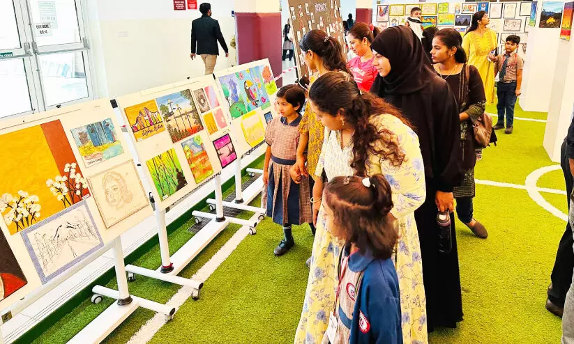Parents watching the art exhibition of students at MES School