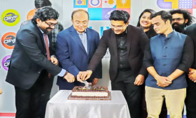 Olive Suno Radio Network 6th Anniversary Announcements Management Member Krishna Kumar, Satish G. Pillai and Aamir Ali start by cutting the cake.