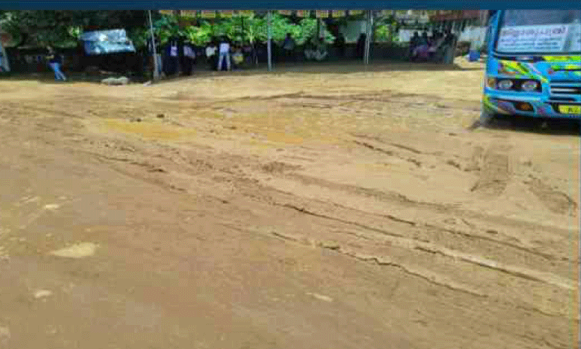 The bus stand yard is a muddy puddle when it rains.