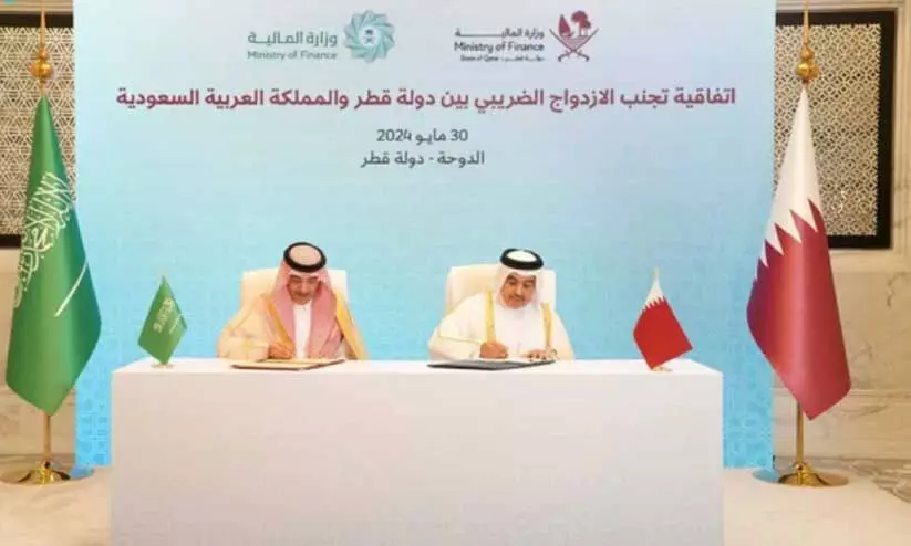 Saudi and Qatar Finance Minister agreement signing