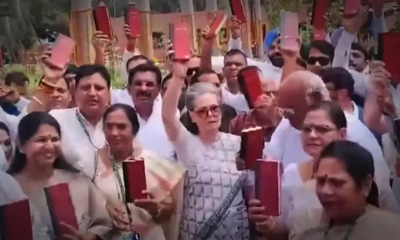 INDIA bloc leaders holding copy of Constitution protest