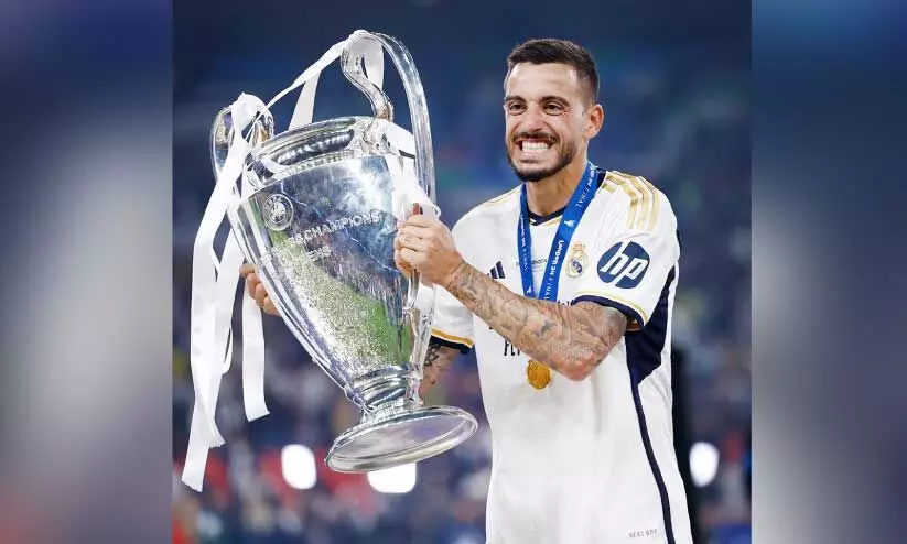 Real Madrid Player Joselu with champions league trophy