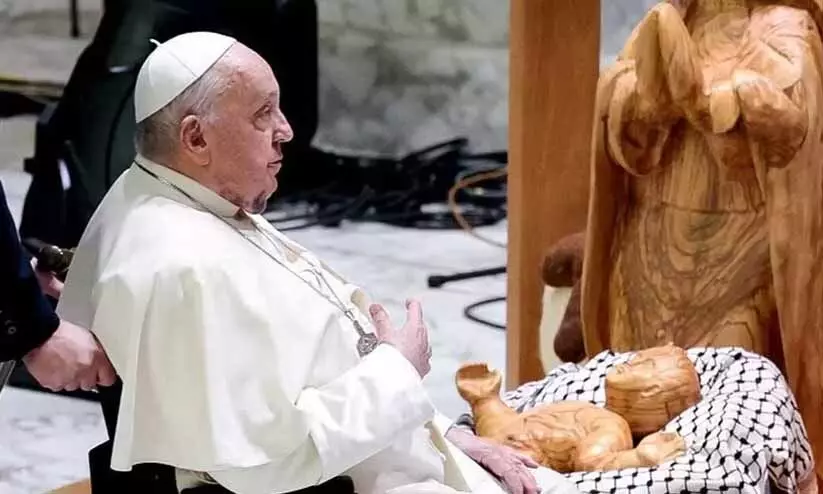 Pope unveils nativity scene with baby Jesus wrapped in Palestinian keffiyeh